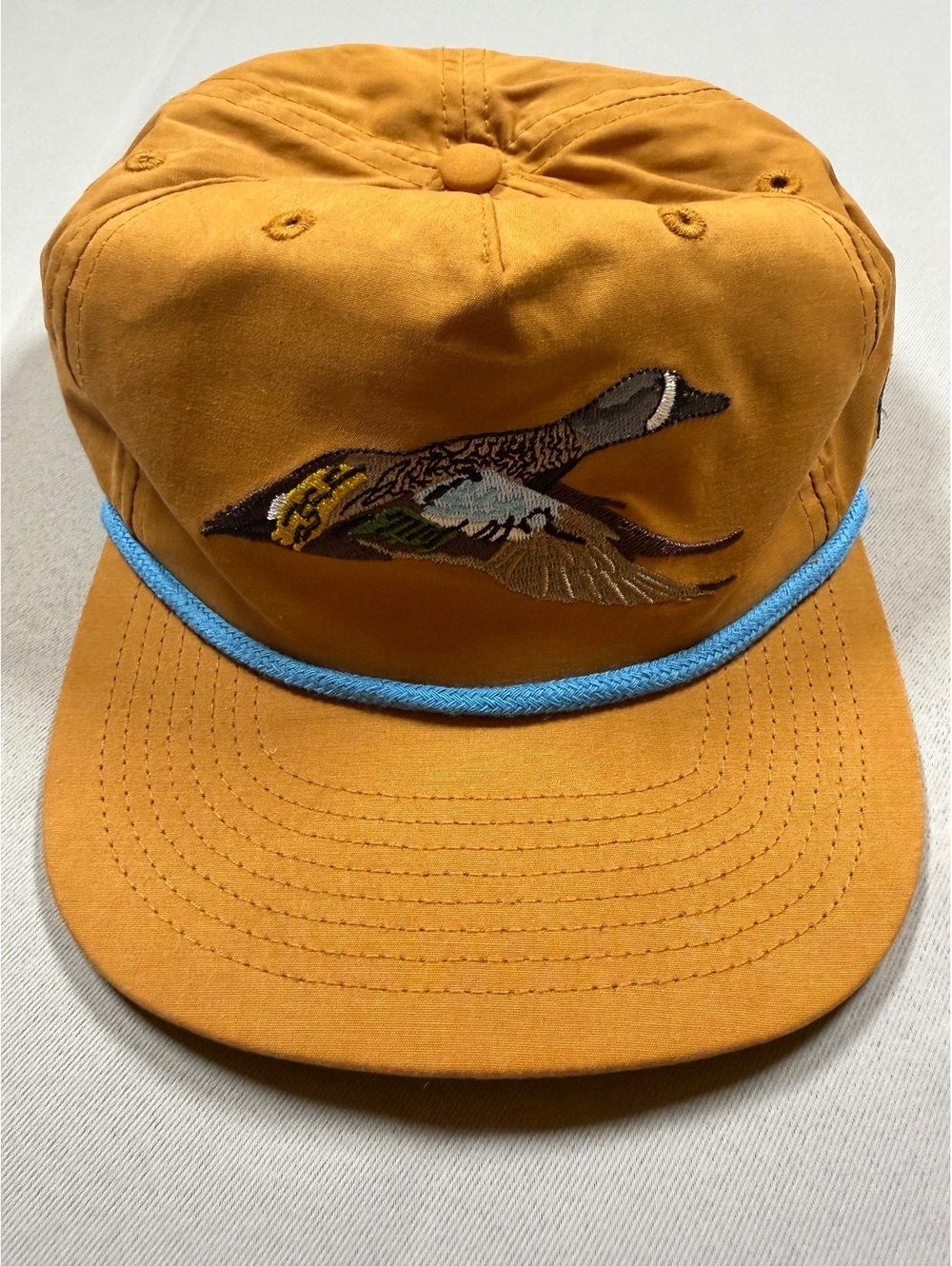 Duck Camp flying duck embroidered mustard cap